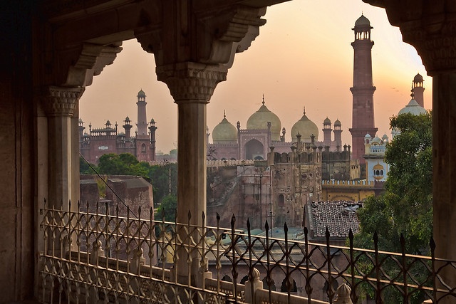  A scenic view from a balcony in Pakistan, showcasing vibrant colors and bustling streets below.